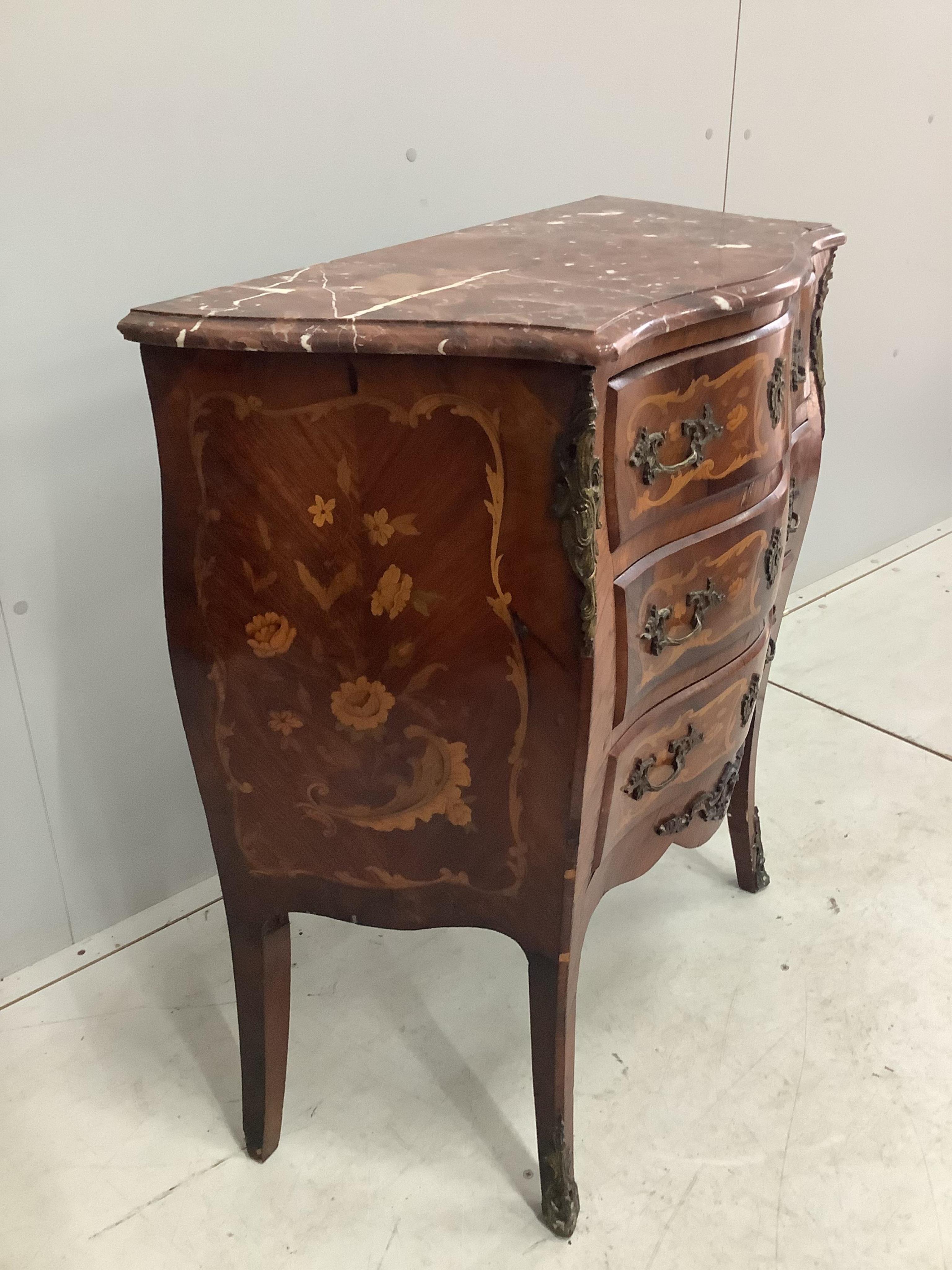 A small French gilt metal mounted marquetry inlaid marble topped bombe commode, width 80cm, depth 38cm, height 86cm. Condition - marble topped corner damaged but piece present